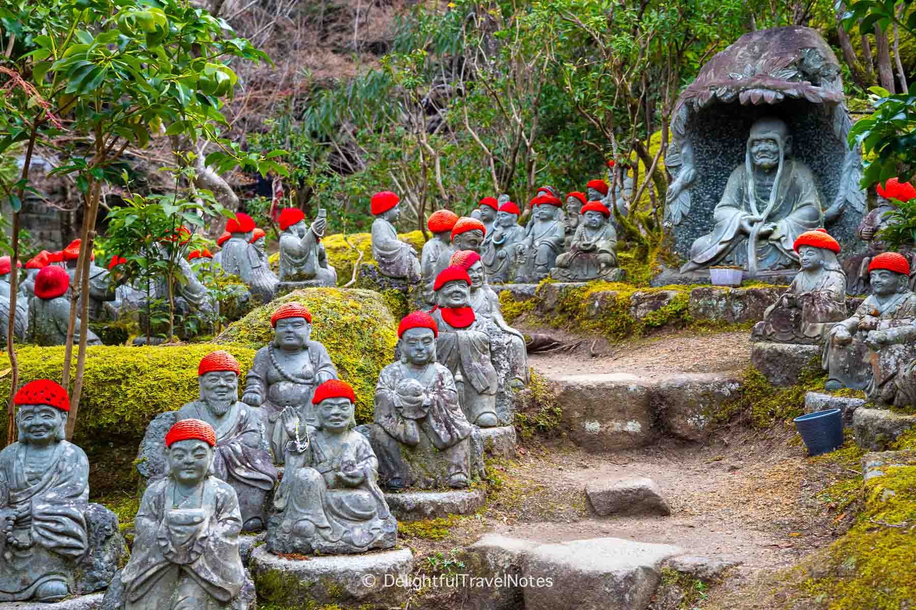 jizo statues with winter red hats in Daisho-in garden, Miyajima Island.