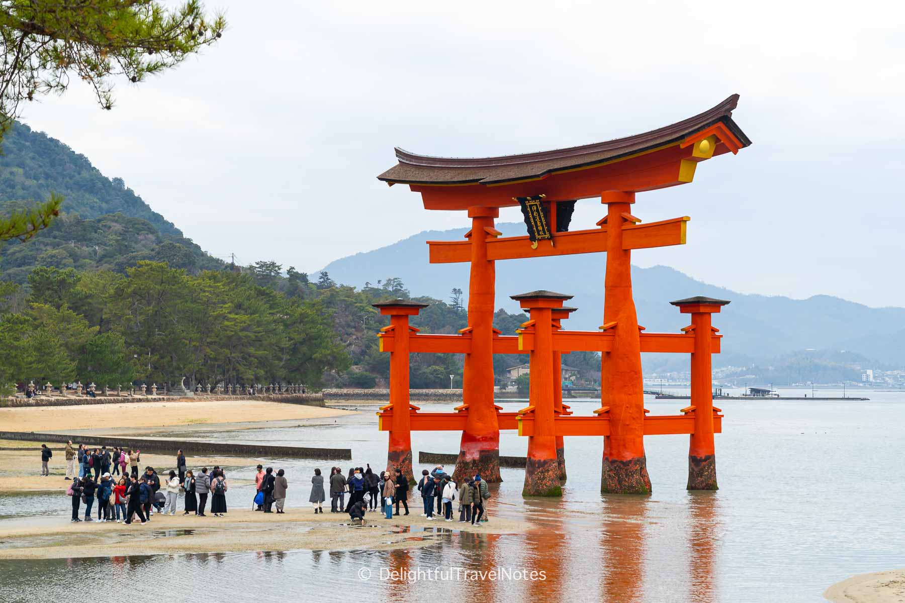 Itsukushima Shrine floating torii gate at low tide.