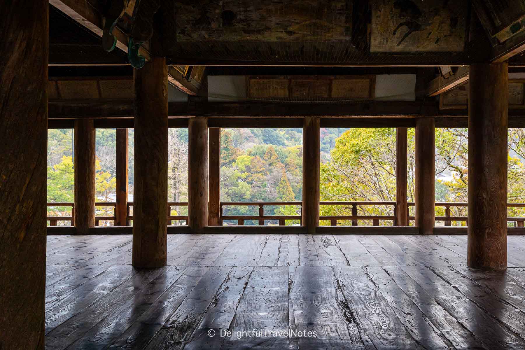 the wooden structures of Senjokaku Pavilion framing the scenery.